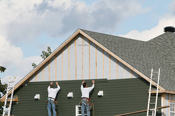 Professional Storm Damage Siding Repair technician working in Geneva, IN